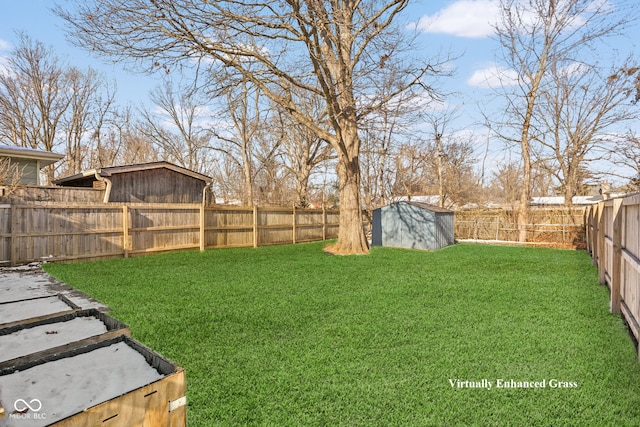 view of yard with a fenced backyard, a storage unit, and an outdoor structure