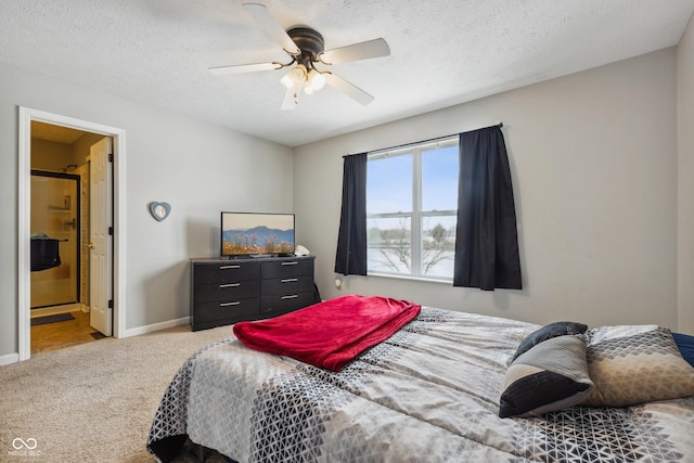 carpeted bedroom with ceiling fan, a textured ceiling, and ensuite bathroom