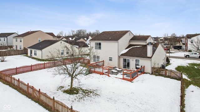 view of snow covered house