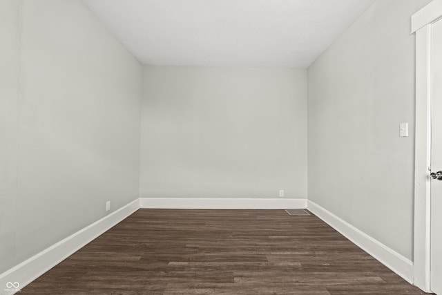 unfurnished room featuring dark hardwood / wood-style floors