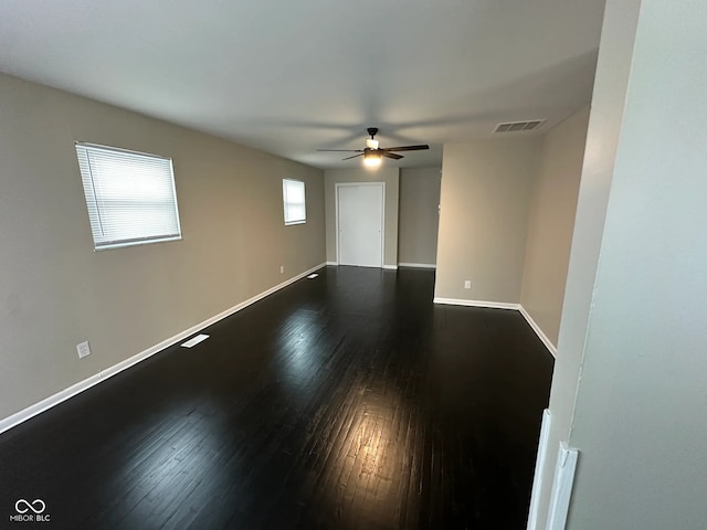 unfurnished room with ceiling fan and hardwood / wood-style floors