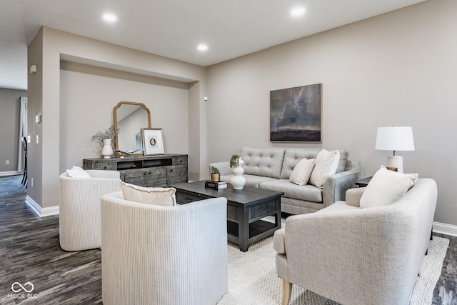 living room featuring recessed lighting, baseboards, and wood finished floors