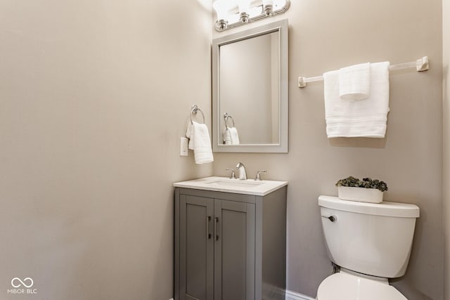 bathroom with toilet and vanity