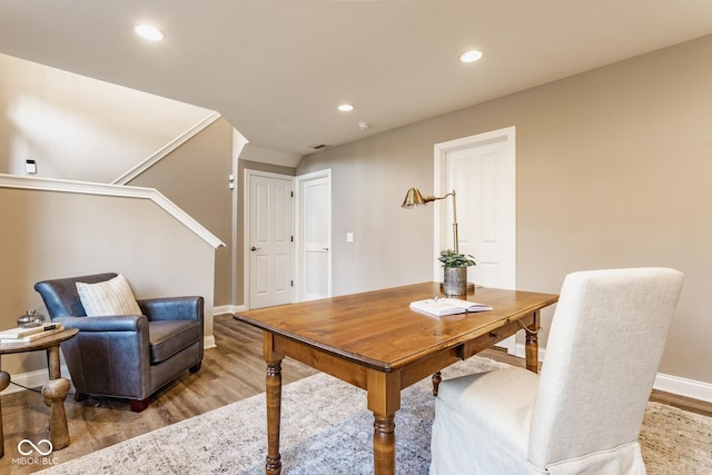 office area featuring light wood finished floors, recessed lighting, and baseboards