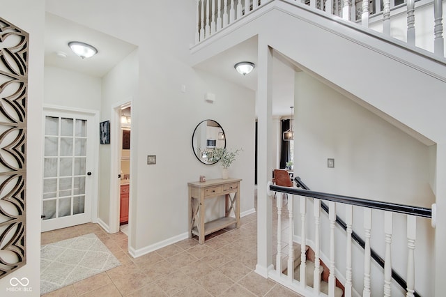 corridor featuring light tile patterned floors