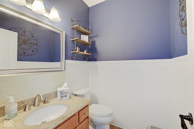 bathroom with toilet and vanity