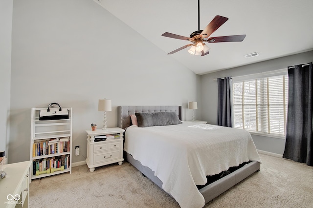 carpeted bedroom with ceiling fan and lofted ceiling