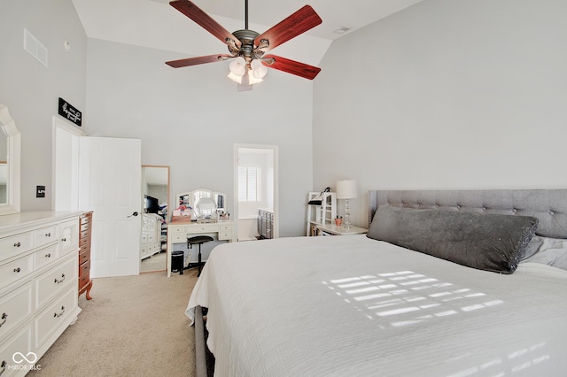 carpeted bedroom featuring high vaulted ceiling and ceiling fan