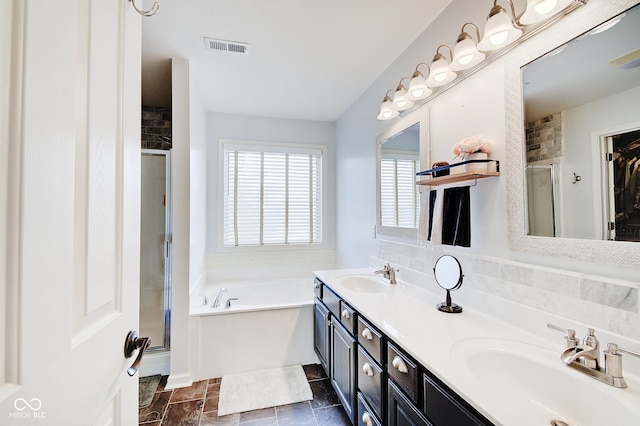 bathroom with independent shower and bath and vanity