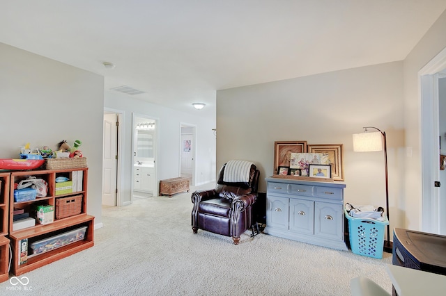 living area with light colored carpet