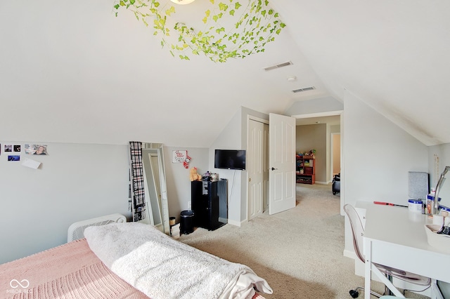 carpeted bedroom featuring lofted ceiling