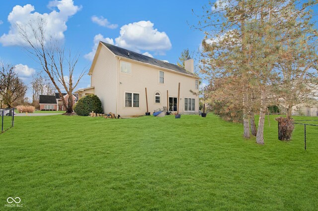 5230 Berkshire S Blvd, Greenwood, IN 46142 - rear view of property featuring a chimney and a lawn