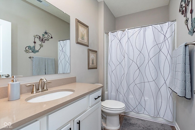 full bathroom featuring toilet, vanity, and shower / tub combo with curtain