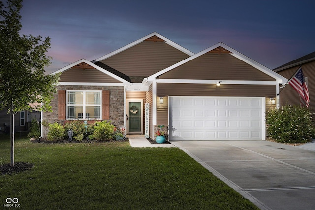 view of front facade featuring a yard and a garage