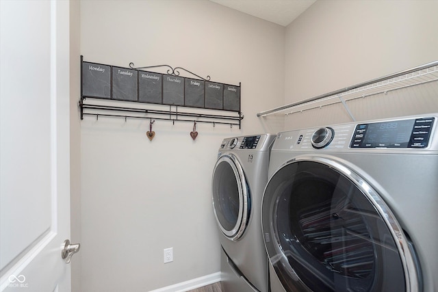 laundry area with separate washer and dryer