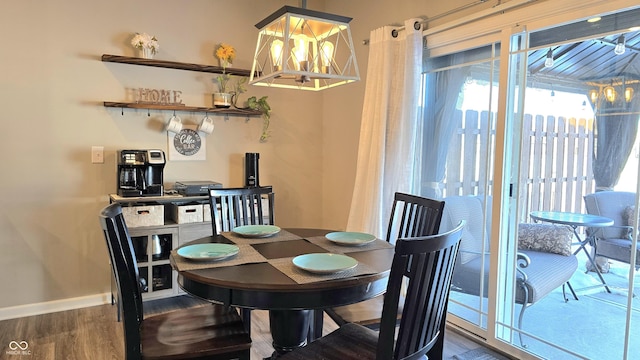 dining space featuring wood-type flooring