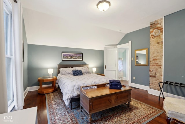 bedroom featuring dark hardwood / wood-style flooring and lofted ceiling