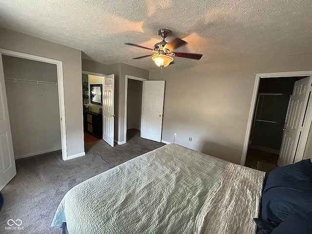 bedroom featuring a textured ceiling, ceiling fan, connected bathroom, and dark carpet