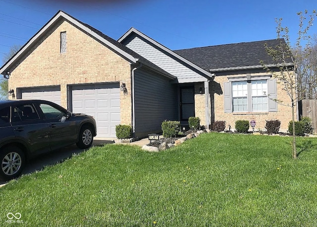 view of front of home with a front lawn and a garage