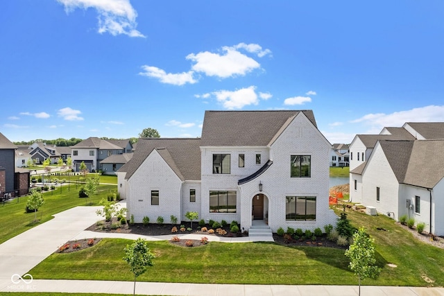 view of front of home with a front yard and a residential view