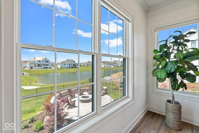 interior space featuring a residential view and a water view