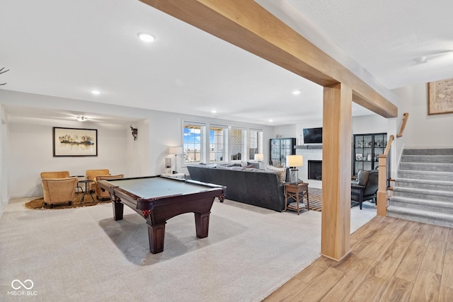 game room featuring light wood-type flooring, billiards, a fireplace, and recessed lighting