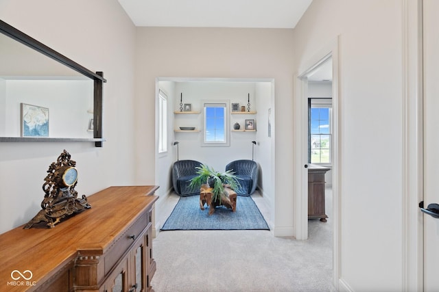 interior space featuring light colored carpet