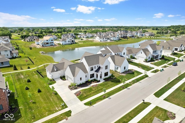 bird's eye view featuring a residential view and a water view