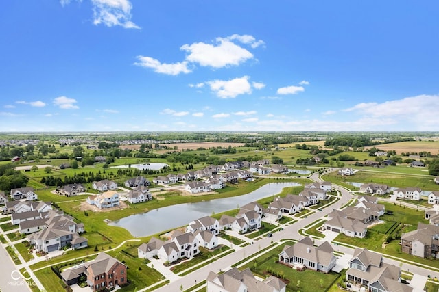 birds eye view of property with a water view and a residential view