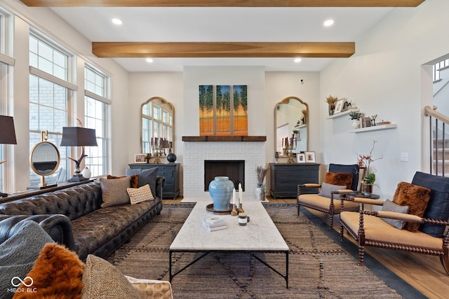 living room featuring a brick fireplace, dark wood finished floors, beam ceiling, and recessed lighting