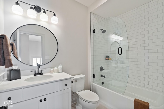 full bathroom featuring toilet, vanity, and washtub / shower combination