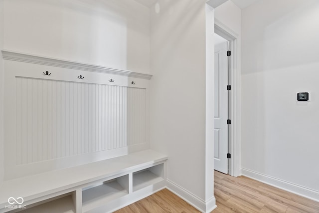 mudroom with light wood-type flooring and baseboards