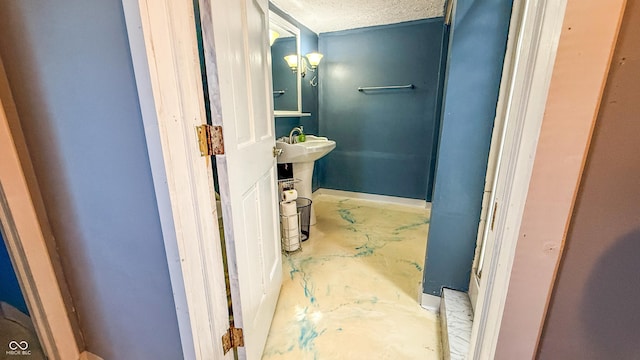 bathroom featuring a textured ceiling