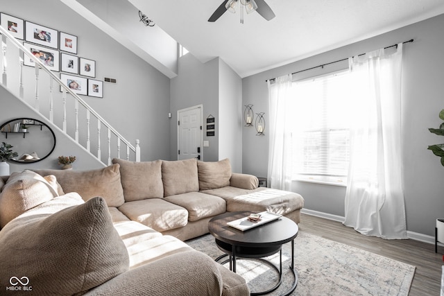 living room featuring a healthy amount of sunlight, hardwood / wood-style floors, and ceiling fan