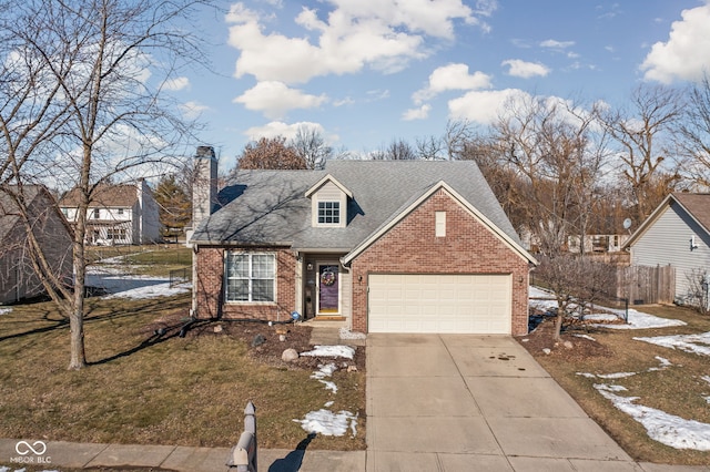 view of front of home featuring a yard and a garage