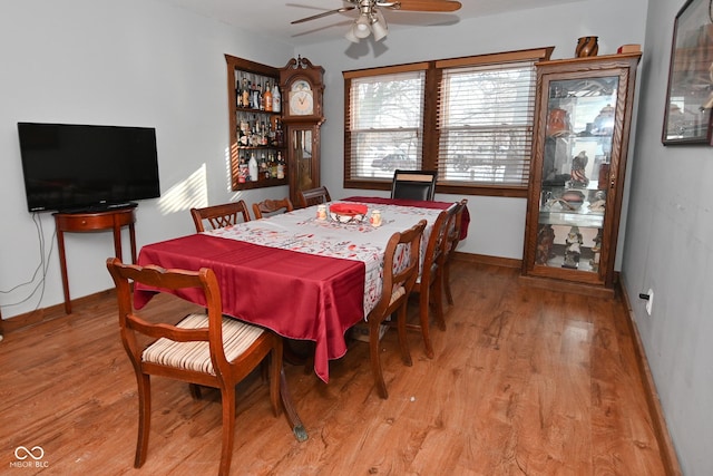 dining room featuring ceiling fan and light hardwood / wood-style floors