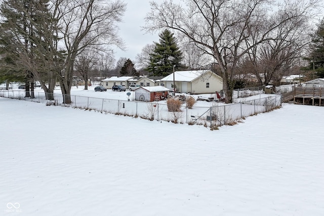 view of yard layered in snow