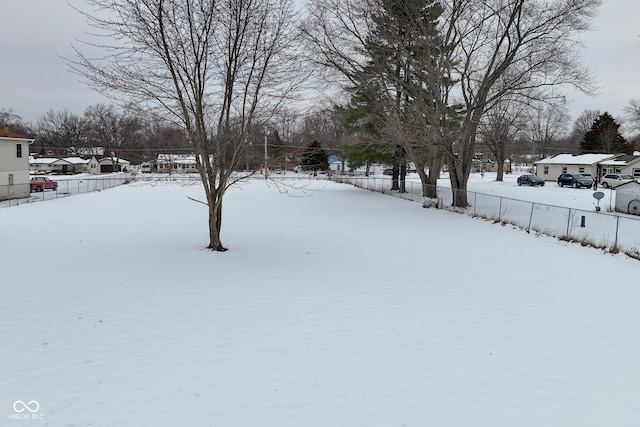 view of yard layered in snow