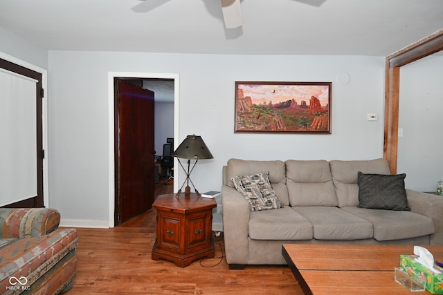 living room featuring ceiling fan and wood-type flooring