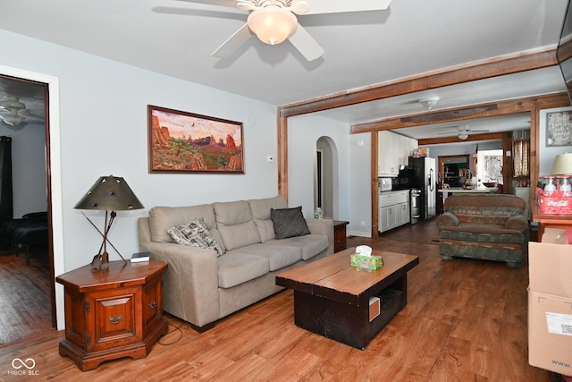 living room with hardwood / wood-style flooring and ceiling fan