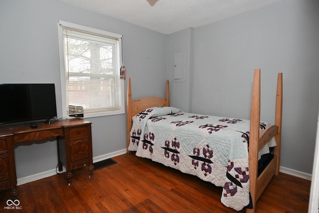 bedroom featuring dark hardwood / wood-style floors