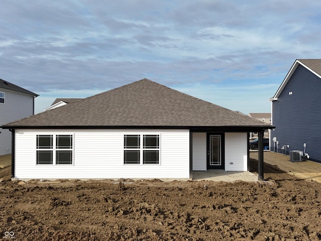 back of house featuring central AC unit