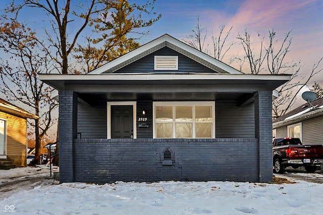 bungalow-style home with a porch