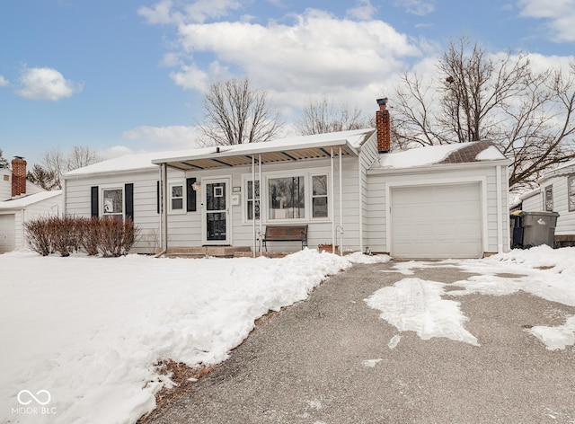 ranch-style house featuring a garage