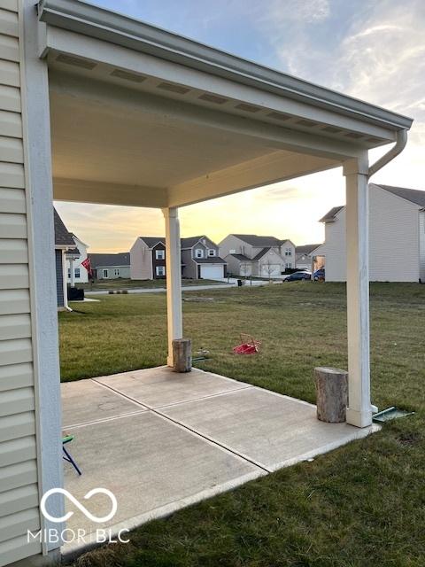 patio terrace at dusk with a lawn