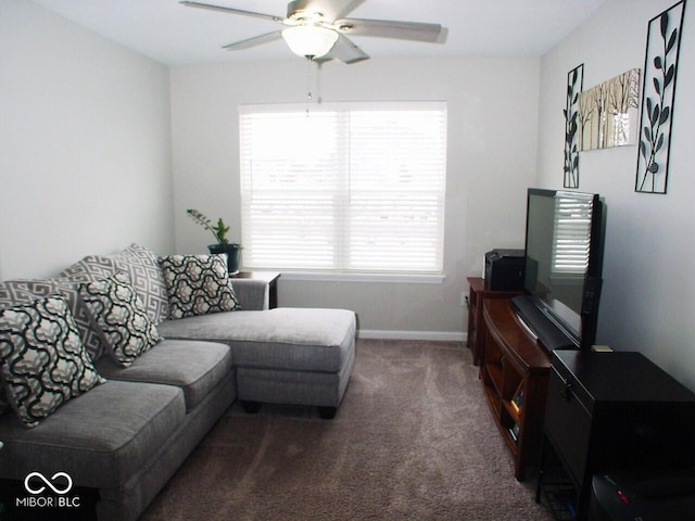 living room with dark carpet and ceiling fan