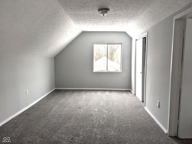 bonus room featuring carpet floors, a textured ceiling, and vaulted ceiling