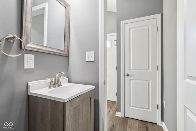 bathroom featuring vanity and hardwood / wood-style floors