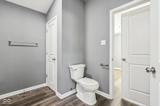 bathroom featuring toilet and hardwood / wood-style floors