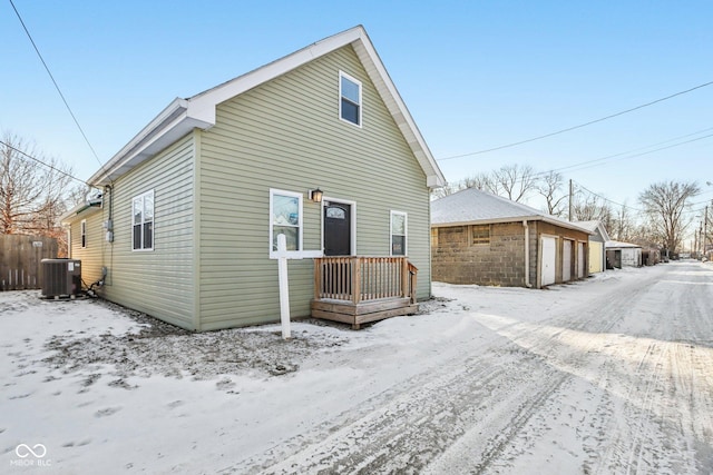 exterior space featuring a garage and central AC unit